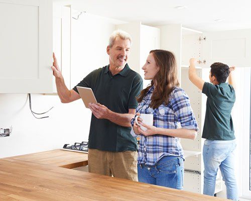 Home Inspections — People Inspecting House in Jacksonville, FL