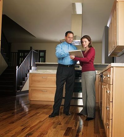 Pre-Market House Inspections — House Inspectors Talking to Client in Jacksonville, FL