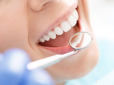 Close-up of woman having her teeth examined - Dentist in Williamstown, NJ Close-up of woman having her teeth examined - Dentist in Williamstown, NJ