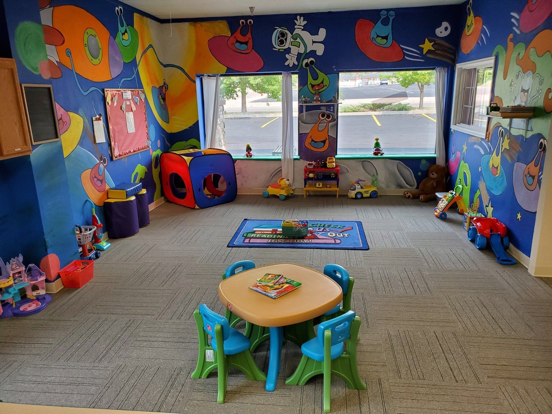 Room with Cute Space Murals — Cheyenne, WY — The Backyard Child Care Center
