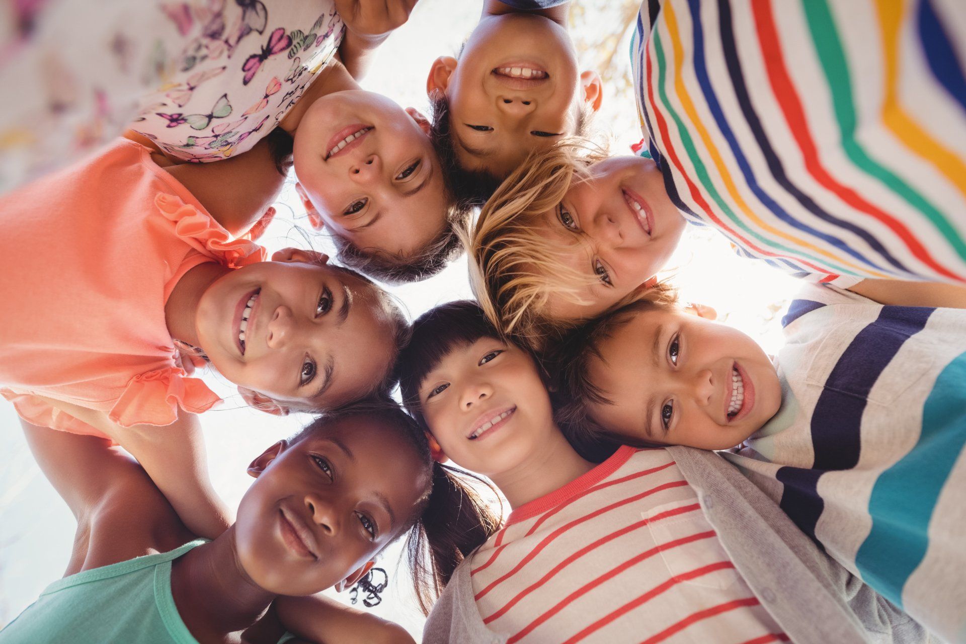 Children Grouping in Circle Formation — Cheyenne, WY — The Backyard Child Care Center Children Grouping in Circle Formation — Cheyenne, WY — The Backyard Child Care Center