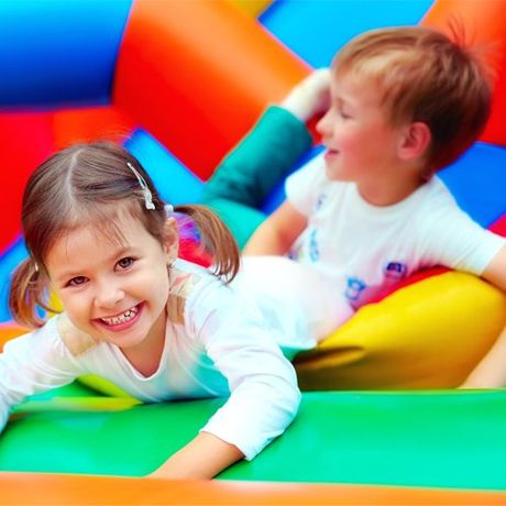 Playing on Inflatable Playground — Cheyenne, WY — The Backyard Child Care Center Playing on Inflatable Playground — Cheyenne, WY — The Backyard Child Care Center