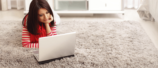 Woman and Laptop — Designer Carpeting in Hudson, FL Woman and Laptop — Designer Carpeting in Hudson, FL