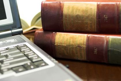 Two law books and a laptop