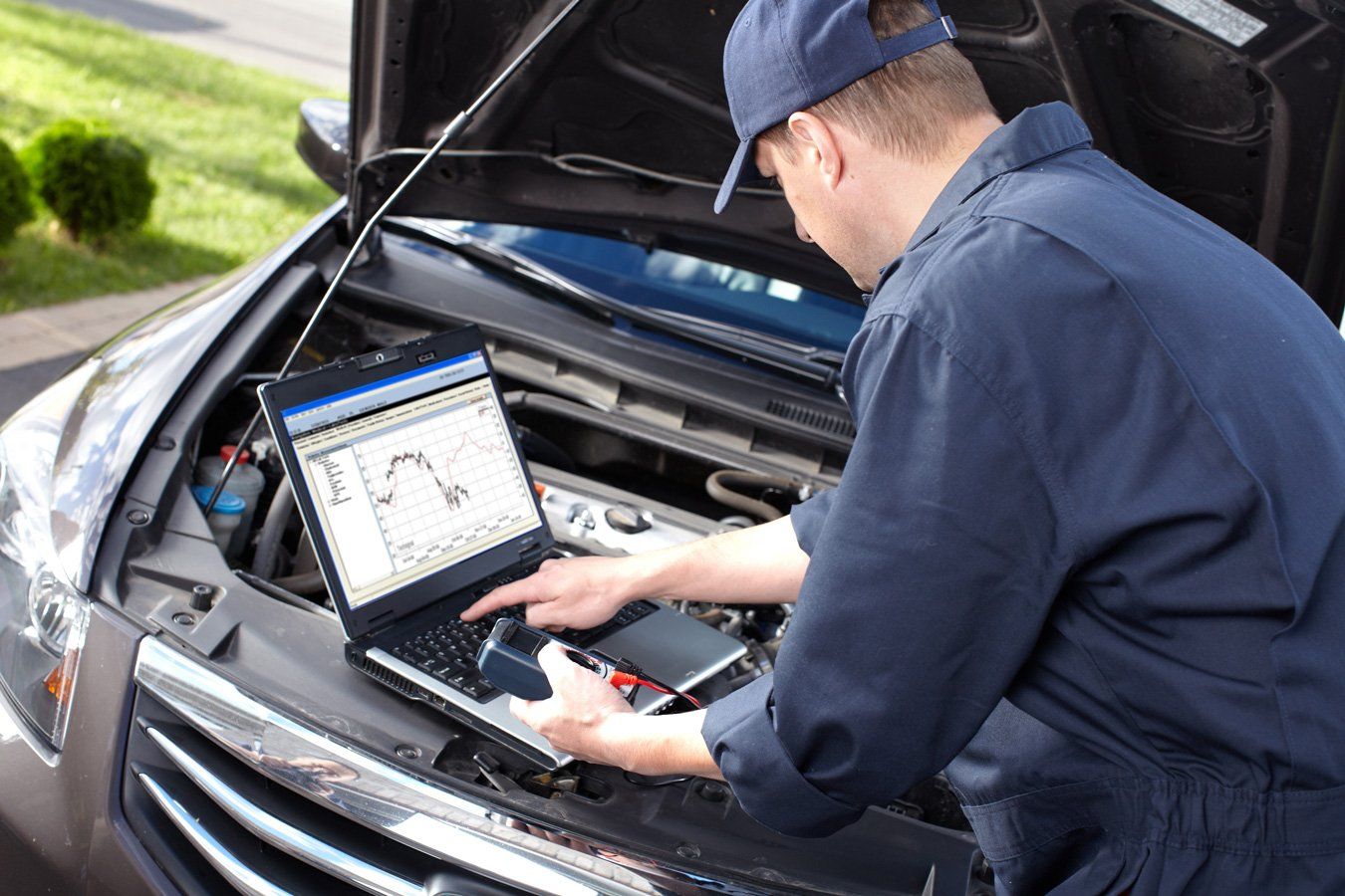 man checking car diagnosis