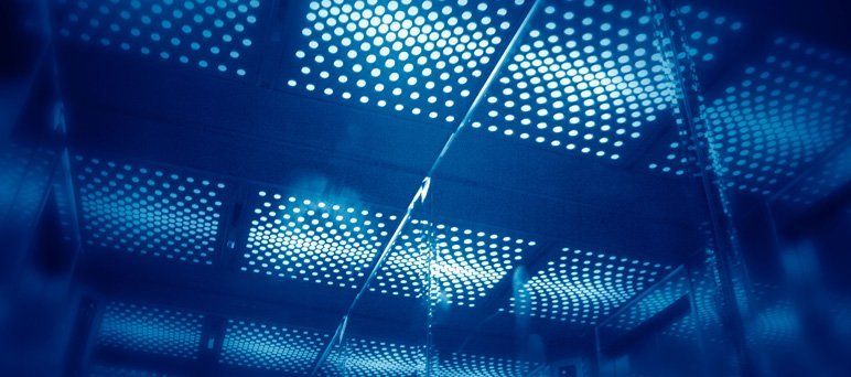 Ceiling lights in modern lift reflected in mirror