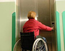 Disabled Lifts Woman in Wheelchair calling Lift