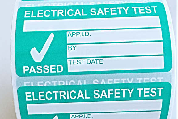A reel of Electrical Safety Test / PAT Test labels