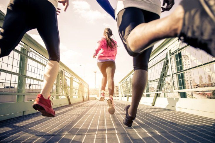 2 women and a man running