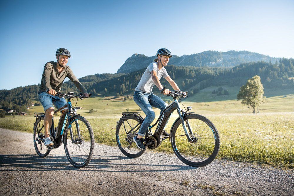 People driving Giant E-Bikes in the mountain sides