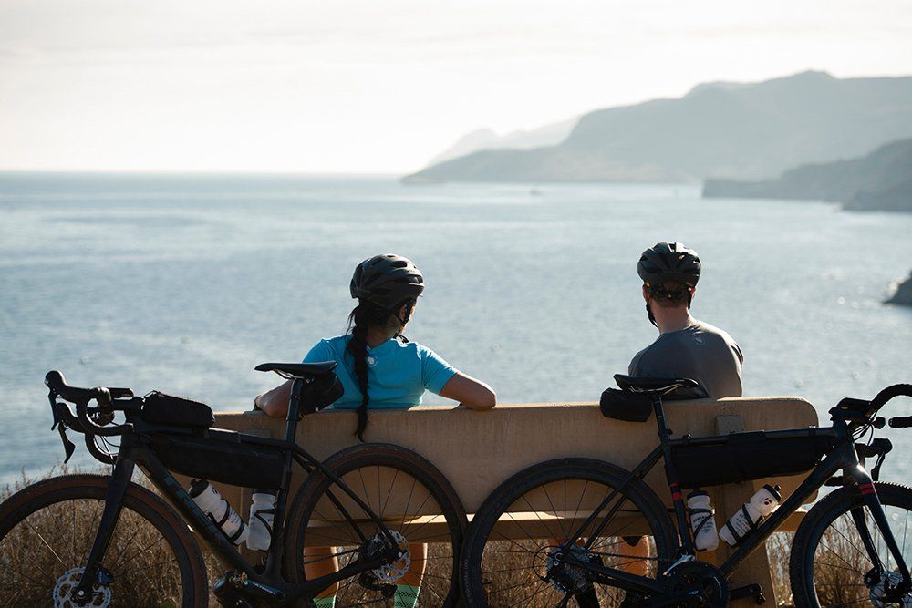 2 Cyclists with Gravel Bike Products