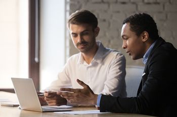 two people talking about computer