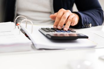 person using calculator