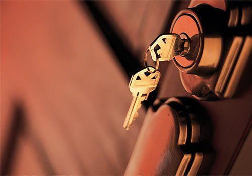 Locksmith — A Door Knob With An Inserted Key in Boston, MA
