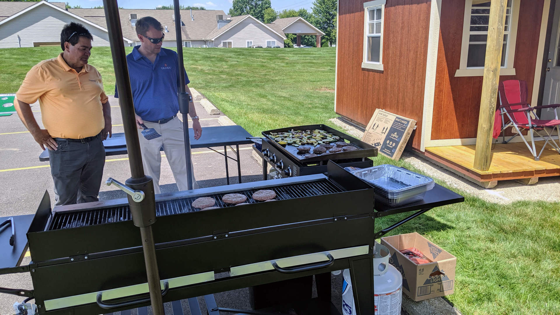 Two employees at the grill