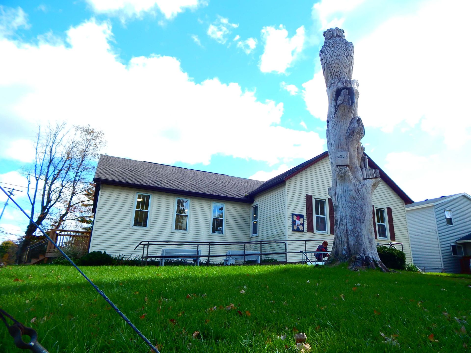A house with a large statue in front of it.