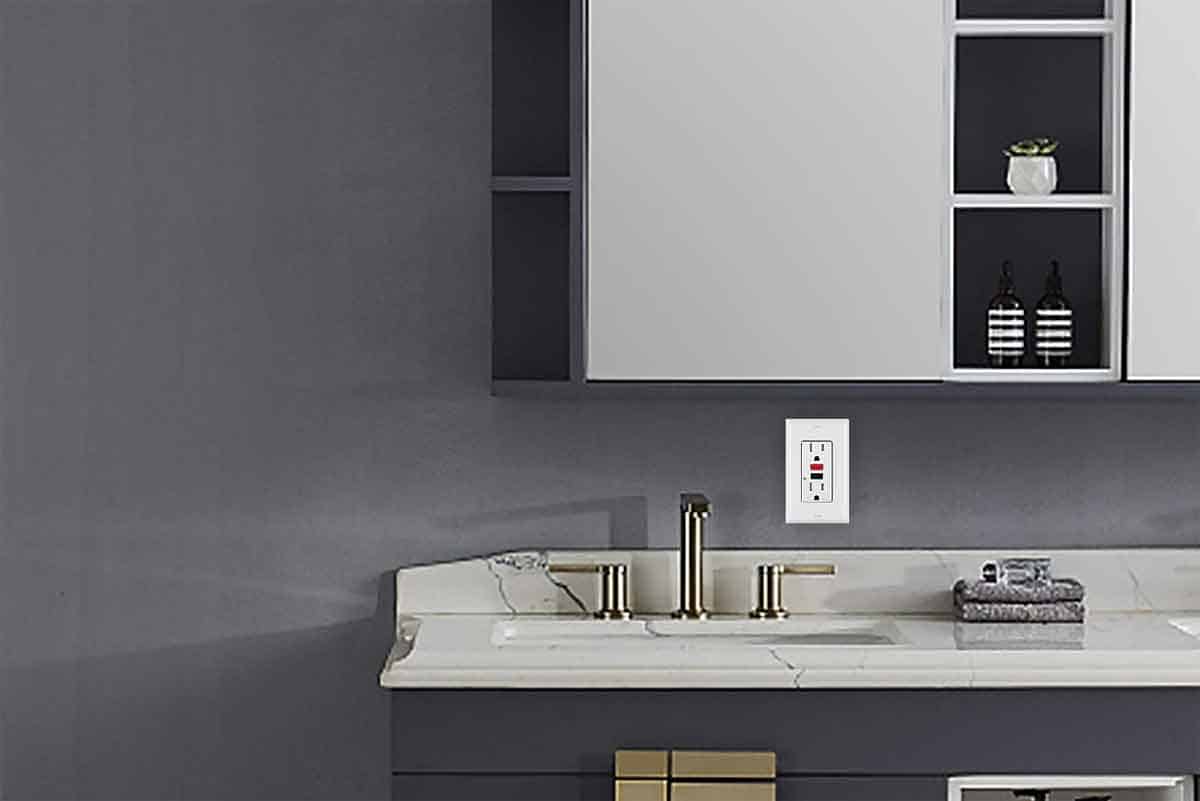 A bathroom with a sink , mirror and cabinets.