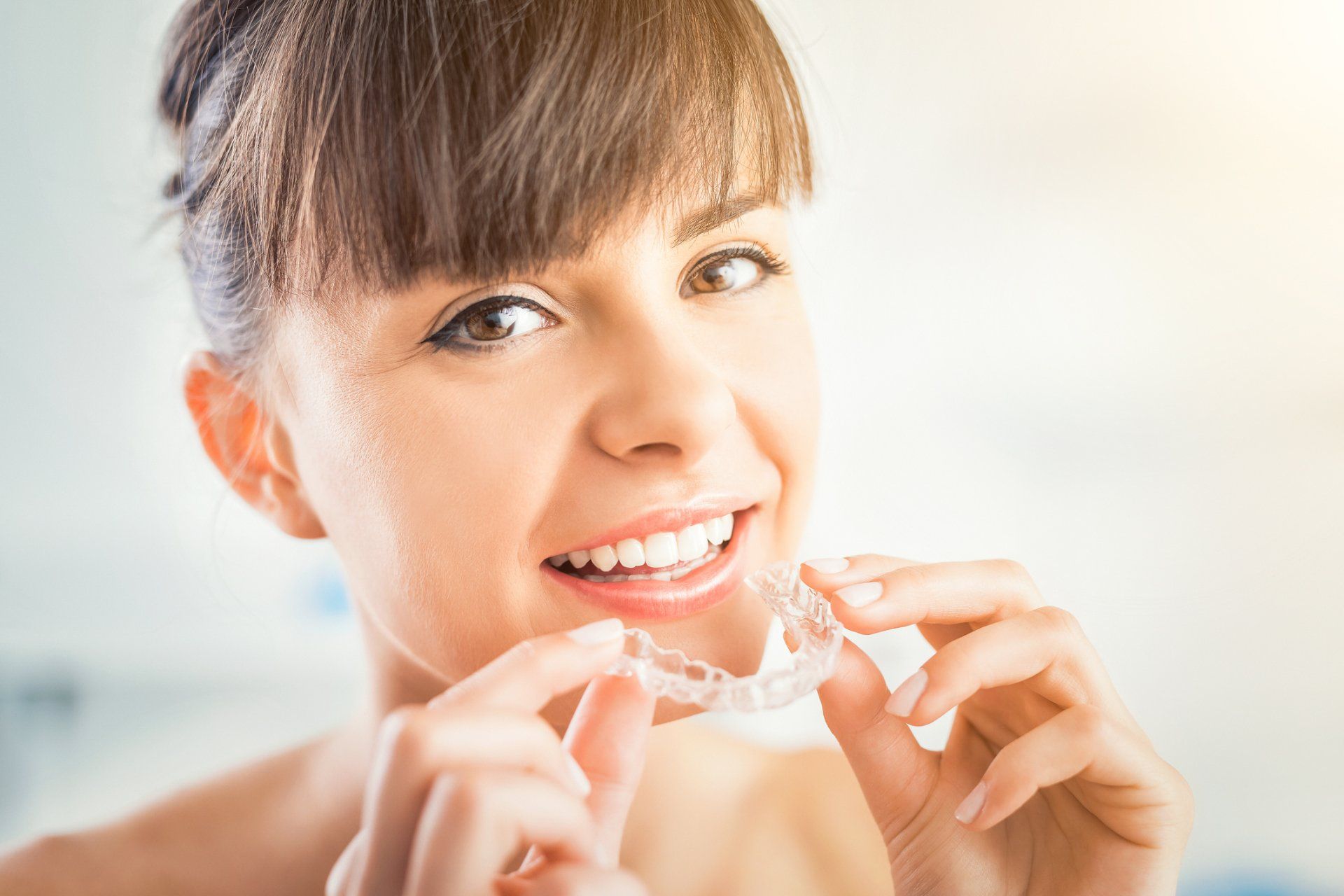 Cosmetic Dentists — Woman Wearing Orthodontic Silicone Trainer in Statesville, NC Cosmetic Dentists — Woman Wearing Orthodontic Silicone Trainer in Statesville, NC