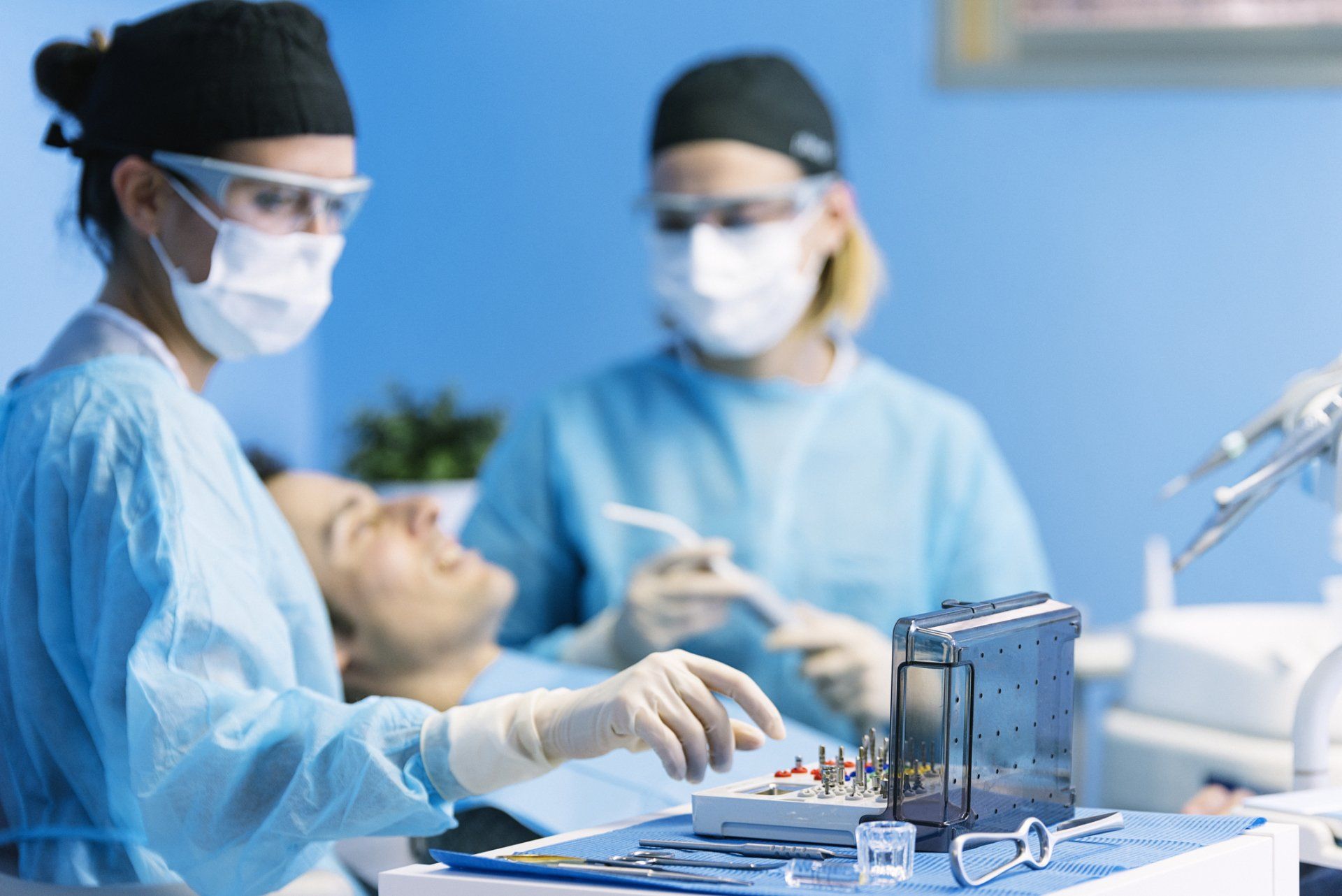 Surgical Dental Services — Dentists with a Patient During a Dental Intervention in Statesville, NC Surgical Dental Services — Dentists with a Patient During a Dental Intervention in Statesville, NC