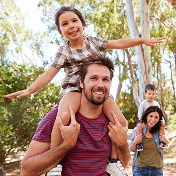 Dad Carrying His Daughter — DeSoto TX — Allergic Diagnostic & Treatment Clinic Dad Carrying His Daughter — DeSoto TX — Allergic Diagnostic & Treatment Clinic