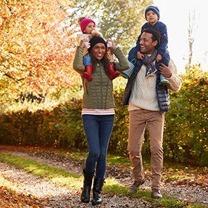 Food Allergy — Husband and Wife Playing with Their Kids in DeSoto, TX
