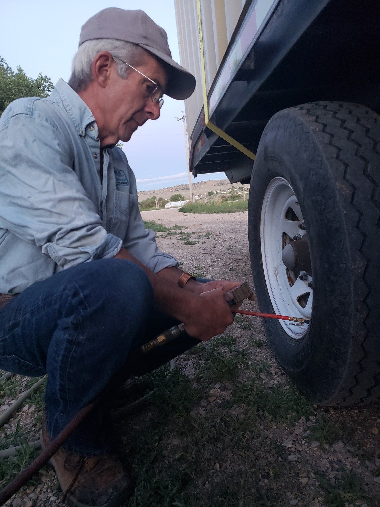 Man Adding Air to Tires — Cody, WY — Say Where Storage