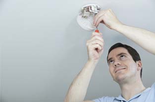 Man Fixing a Security Alarm |Superior Alarm Systems|Upper Darby, PA Man Fixing a Security Alarm |Superior Alarm Systems|Upper Darby, PA