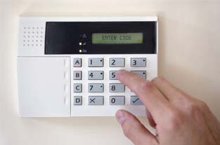 Hand Touching a Security System |Superior Alarm Systems|Upper Darby, PA Hand Touching a Security System |Superior Alarm Systems|Upper Darby, PA