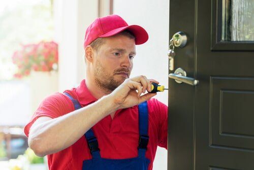 Locksmith in Red Uniform — Rum City Locks and Security in Bundaberg, QLD