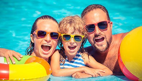 Family enjoying themselves in the pool