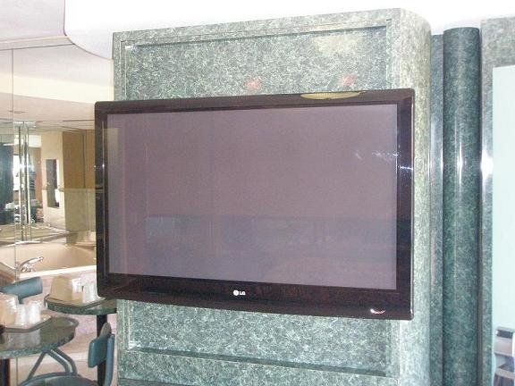 Theme Miami Hotel in FL — Big Television on Wall in Miami, FL