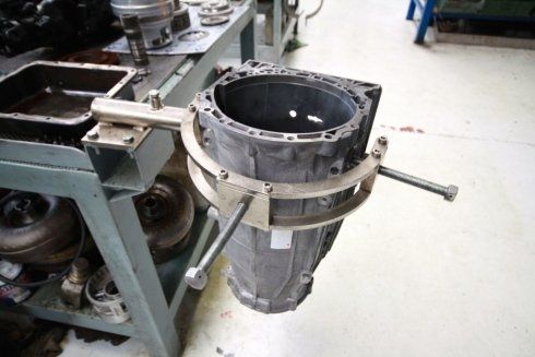 Industrial machine part clamped in a factory assembly setup