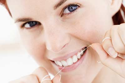 woman flossing