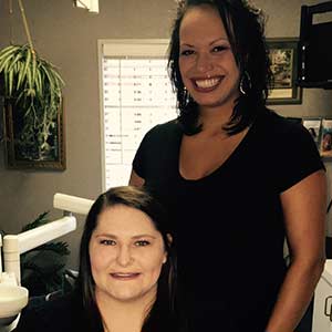 two hygienists in a treatment room two hygienists in a treatment room