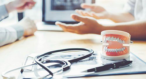 Stethoscope and Denture Model — Oak Forest, IL — Arel C. Ondoy, DMD Stethoscope and Denture Model — Oak Forest, IL — Arel C. Ondoy, DMD
