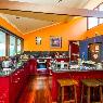 room with red wood cabinets