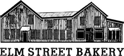 Elm Street Bakery storefront in black and white, two-story building with multiple windows and the bakery name below.