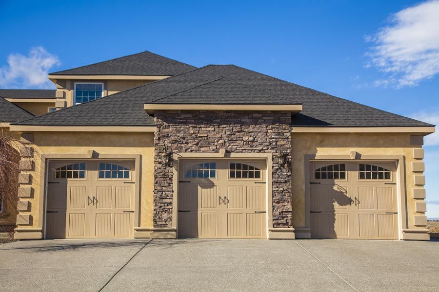 Carriage style garage door design on residential home
