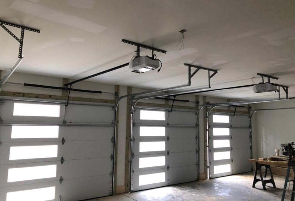 Interior view of garage doors featuring vertical window layout