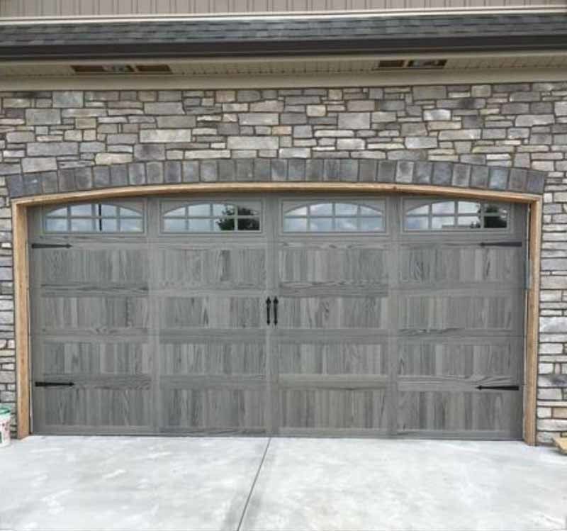 Premium charcoal gray garage door with decorative window panels