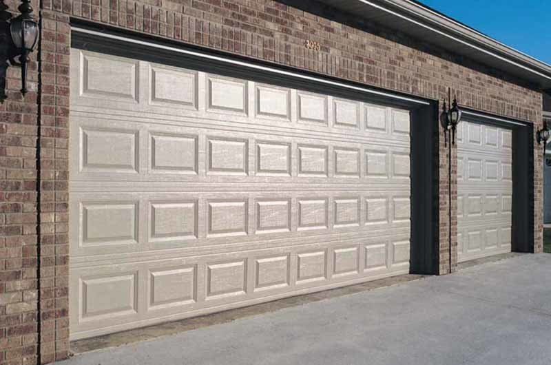 Short panel garage door in almond color