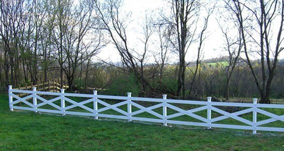 white fence and green grass