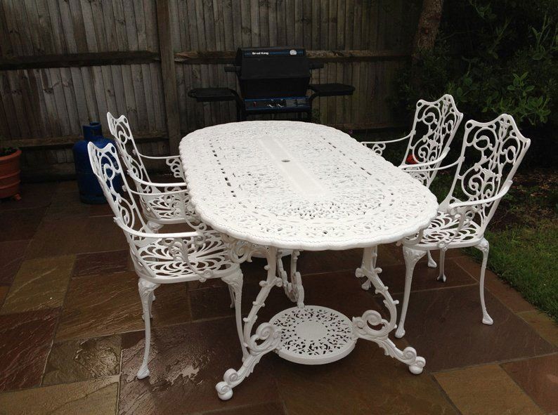 metal dining table painted in white colour