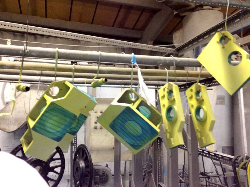 metal components painted in green and blue colour