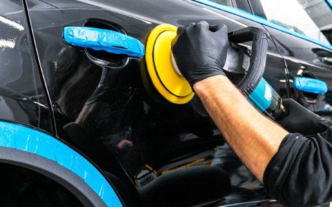 Car Detailing — Worker Applying Car Polish In Greenville, SC Car Detailing — Worker Applying Car Polish In Greenville, SC