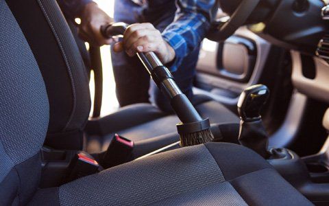 Car Interior — Worker Cleaning The Car Interior In Greenville, SC Car Interior — Worker Cleaning The Car Interior In Greenville, SC
