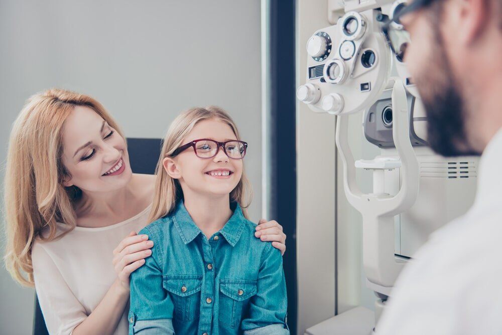 Girl Smiling Wearing Glasses - Clear Optometry In Bargara, QLD Girl Smiling Wearing Glasses - Clear Optometry In Bargara, QLD