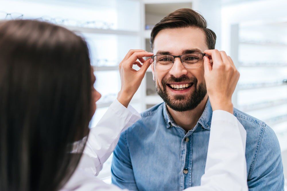 Man Trying Glasses - Clear Optometry In Bargara, QLD