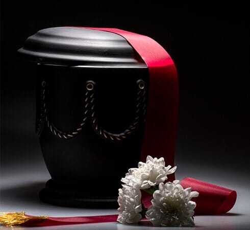 Urn with White Flower — Pet Cremation in Belleview, FL Urn with White Flower — Pet Cremation in Belleview, FL