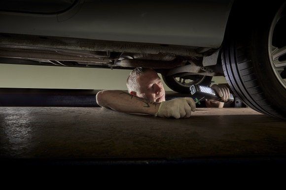 Checking tyre tread depth at Ravenscroft MOT & Service Centre in Fleet, Hampshire